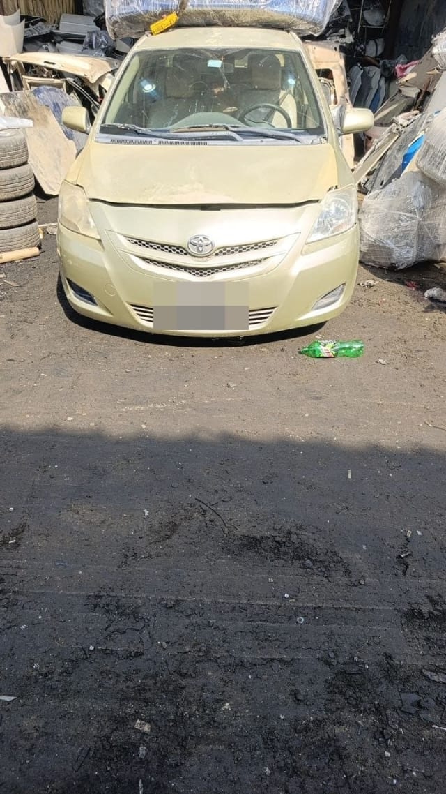 Champagne gold Toyota Yaris sedan for parts — front bumper, grille, headlights and hood, Sharjah market