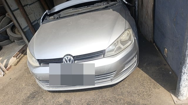Silver VW Golf hatchback front halfcut: hood, headlights, bumper and grille, Sharjah market