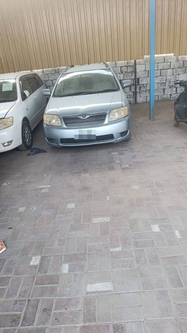 Silver Toyota Corolla Fielder wagon front view, bumper, grille and headlights, Sharjah market