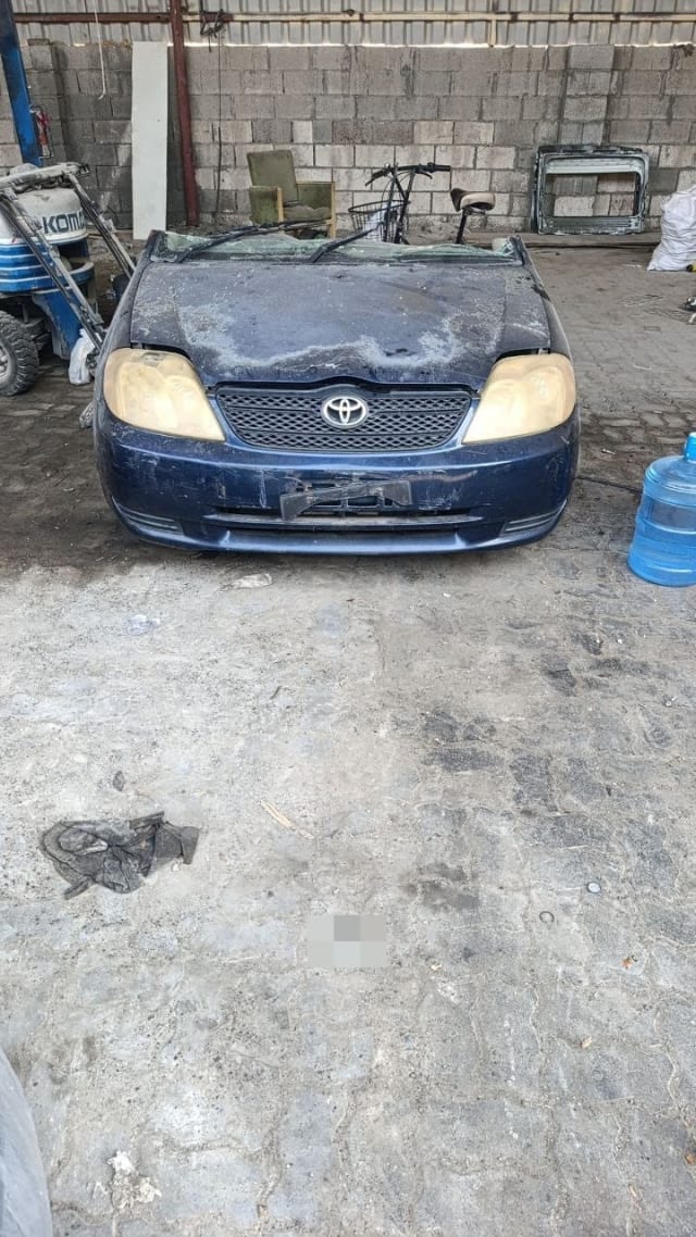 Dark blue Toyota Corolla sedan front halfcut — bumper, grille, headlights and hood, Sharjah market