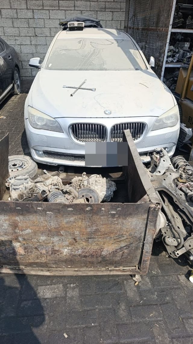 Silver BMW 7-Series sedan for parts, front view with hood, grille and headlights, Sharjah market