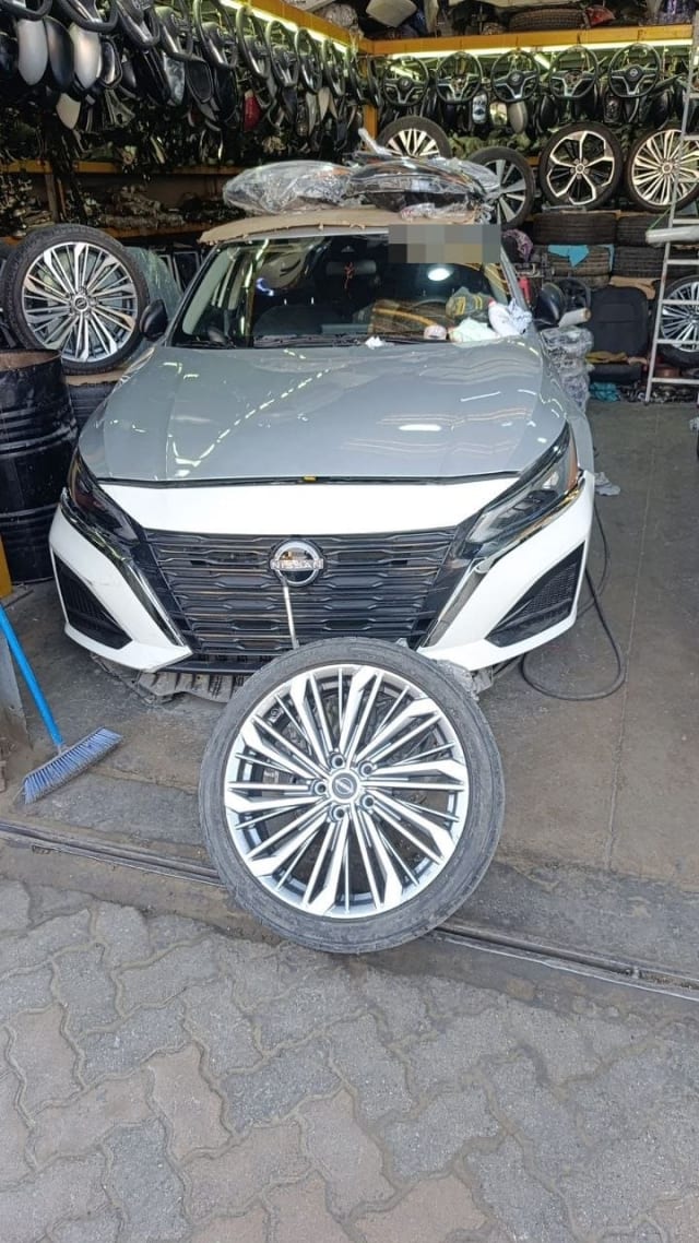 Nissan Sentra halfcut with white bumper, grille, LED headlights and alloy wheel, Sharjah market