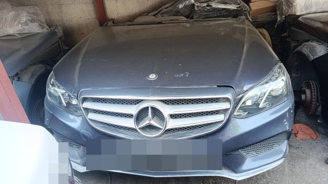Dark grey Mercedes-Benz E-Class front halfcut — hood, chrome grille, headlights and bumper, Sharjah market