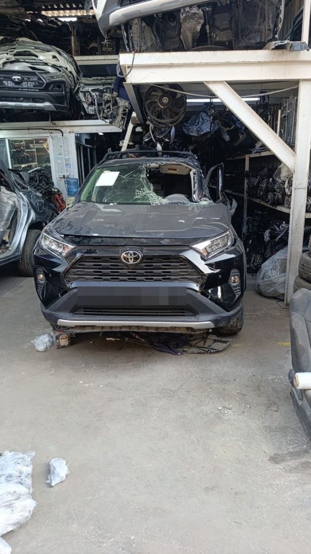 Black Toyota RAV4 SUV car for parts — hood, bumper, grille and LED headlights, Sharjah market