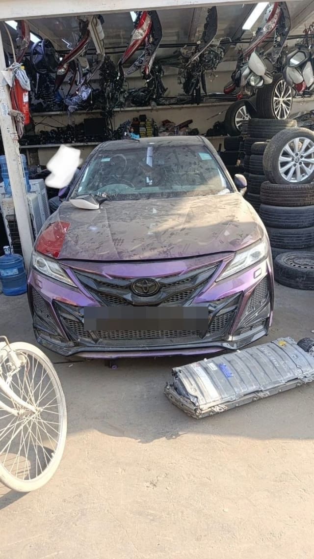 Purple Toyota Camry sedan halfcut, front view with bumper, grille, headlights and hood, Sharjah market