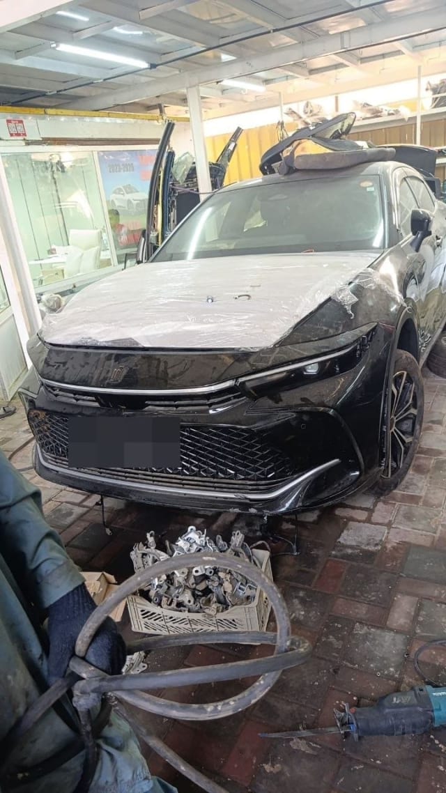 Black Toyota Crown crossover sedan for parts — front bumper, grille, LED headlights and hood, Sharjah market