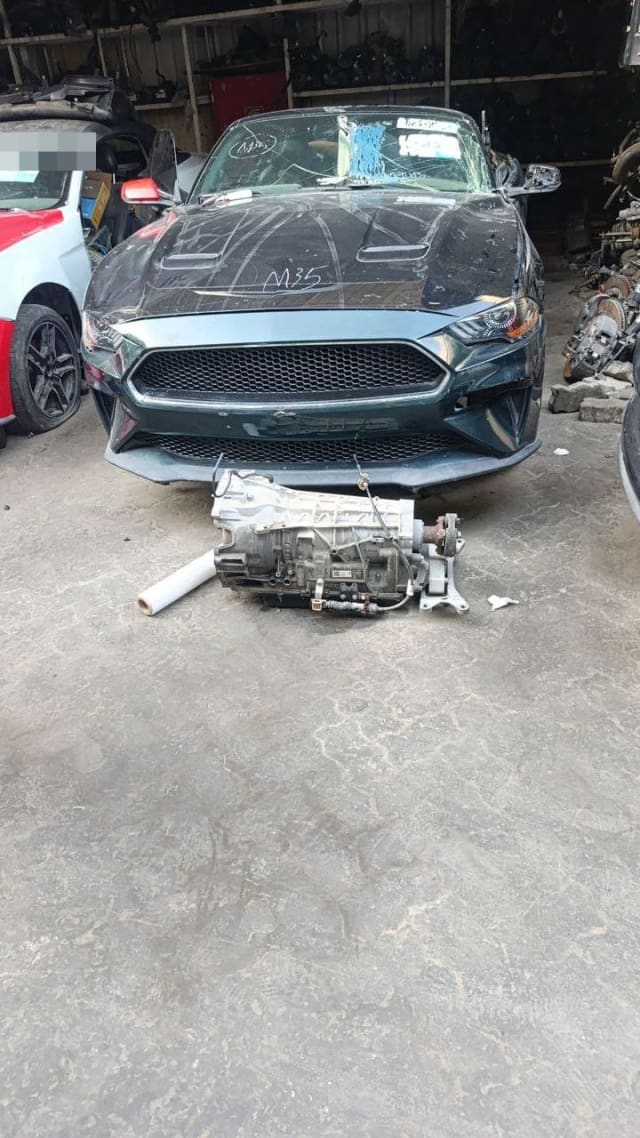 Dark green Ford Mustang Bullitt for parts, front view with transmission on floor, Sharjah market
