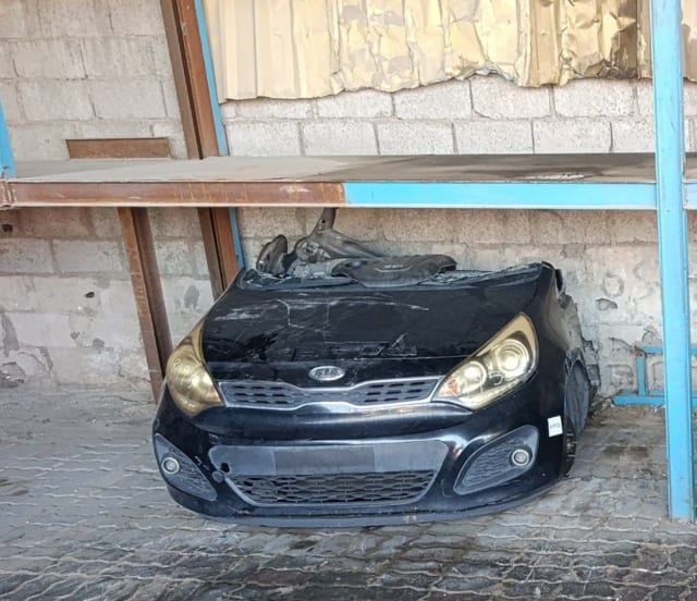 Black Kia Rio front halfcut with hood, grille, headlights and bumper, Sharjah market