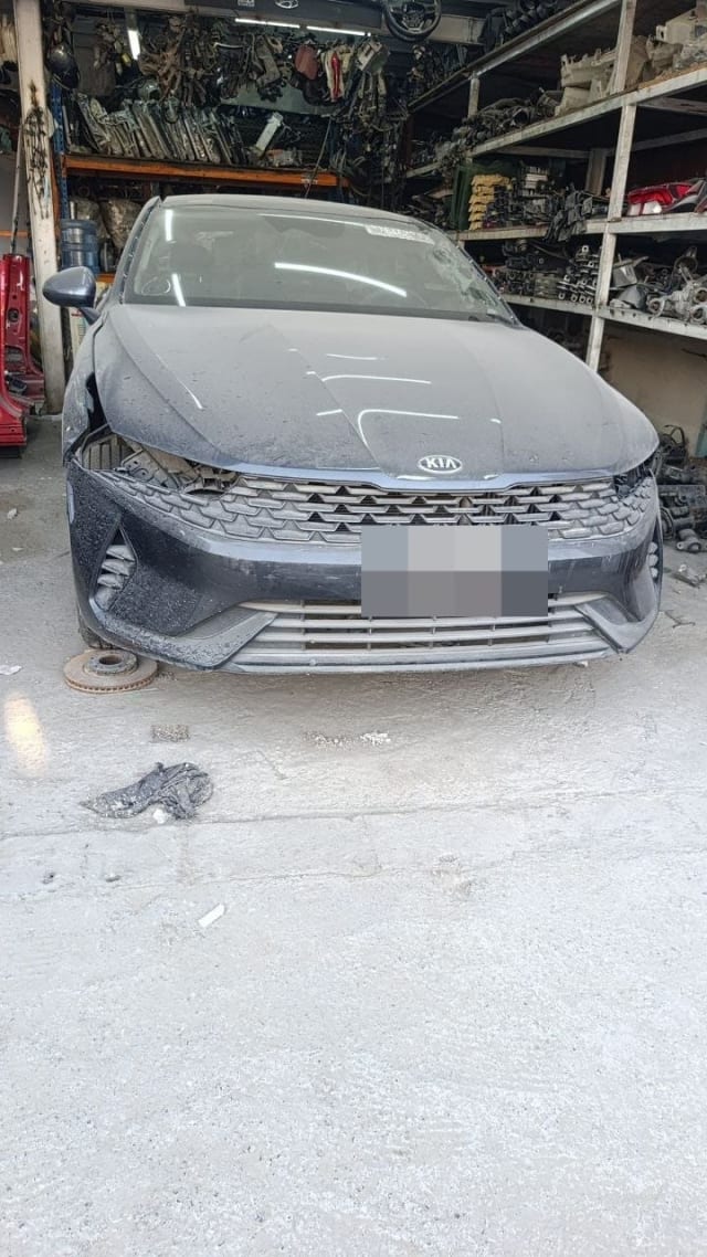Dark grey Kia K5 / Optima sedan for parts, front view: hood, bumper and grille, Sharjah market