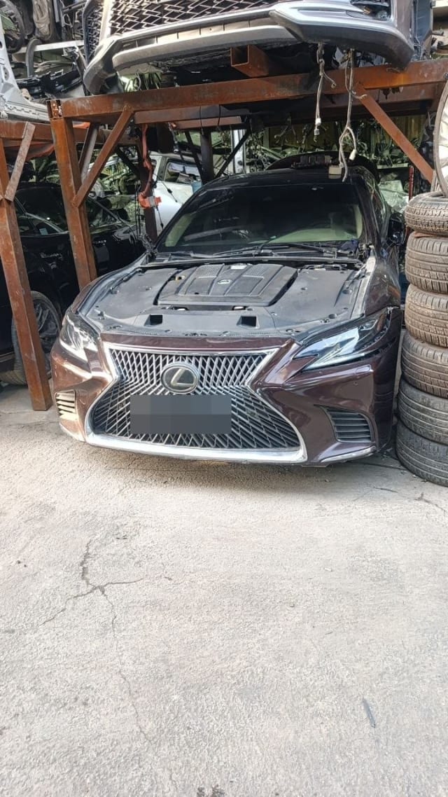 Dark maroon Lexus LS sedan for parts, hood off — spindle grille, bumper, headlights, engine, Sharjah market