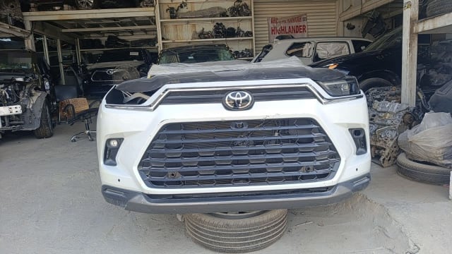 White Toyota Highlander front halfcut with bumper, mesh grille, fog lights and hood, Sharjah market