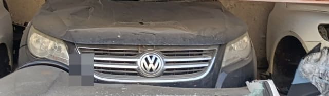 Dark grey Volkswagen Tiguan front halfcut — hood, chrome grille and headlights, Sharjah market