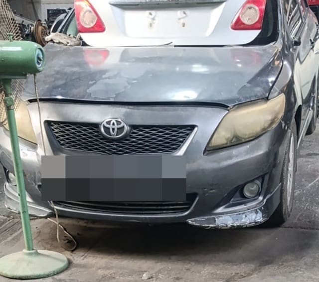 Dark grey Toyota Corolla halfcut front: hood, bumper, grille and headlights, Sharjah market