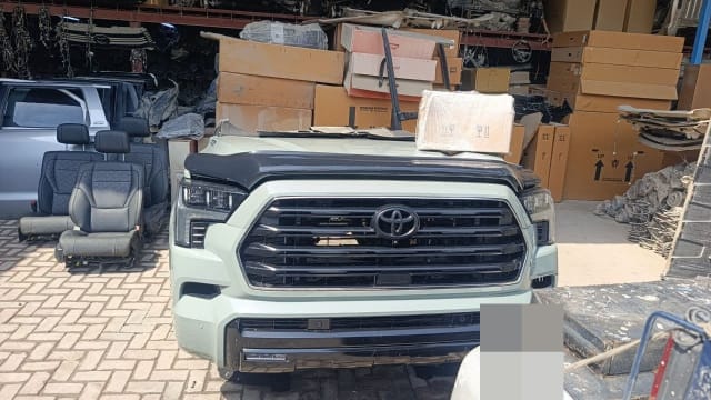 Sage green Toyota Sequoia front halfcut — grille, headlights, bumper and hood, Sharjah market