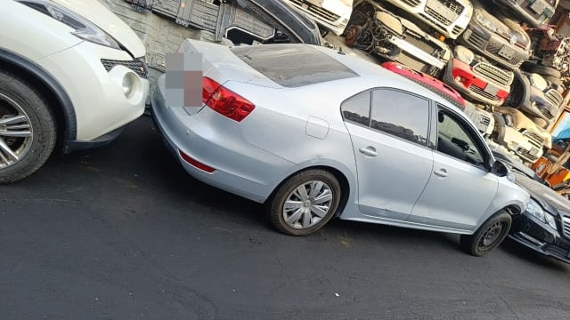 Silver Volkswagen Jetta sedan for parts — rear bumper, taillights, trunk and doors, Sharjah market