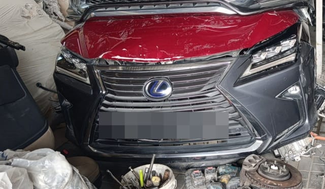 Dark grey Lexus RX front halfcut — spindle grille, LED headlights and red hood, Sharjah market
