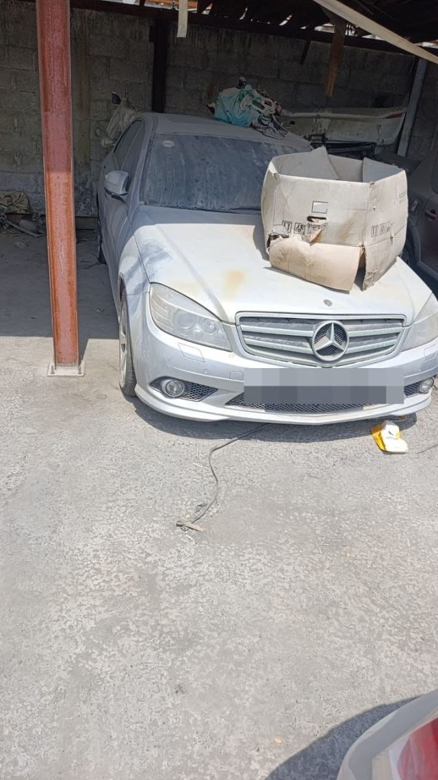 Dusty silver Mercedes-Benz C-Class sedan for parts with bumper, grille and headlights, Sharjah market