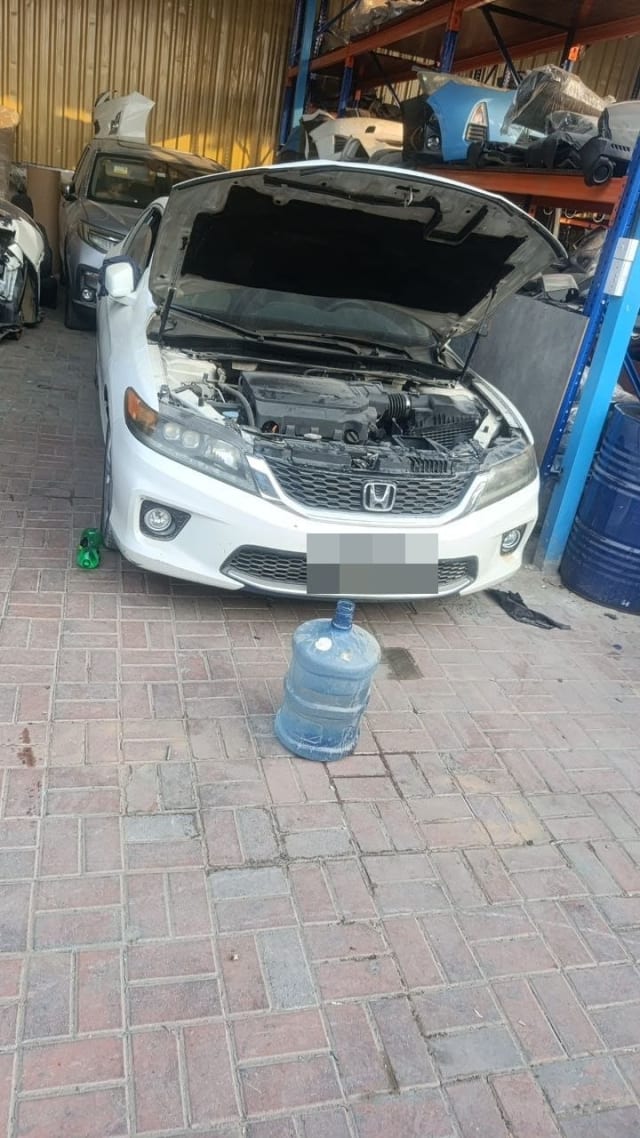 White Honda Accord halfcut, hood open: engine bay, front bumper, grille and headlights, Sharjah market