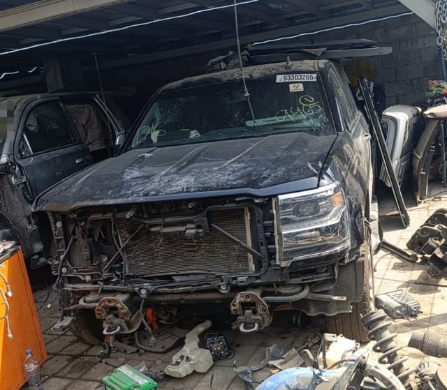 Black GMC Sierra pickup halfcut, bumper removed: hood, headlight, radiator and support, Sharjah market