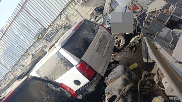 White Chevrolet Suburban rear halfcut — liftgate, red tail lights and rear quarter panels, Sharjah market