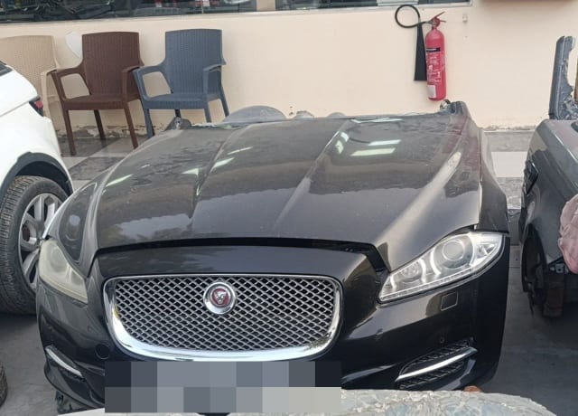 Black Jaguar XJ front halfcut with hood, chrome mesh grille, bumper and headlights, Sharjah market