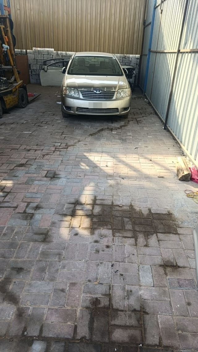 Champagne Toyota Corolla sedan for parts, front view with bumper, grille, headlights and hood, Sharjah market