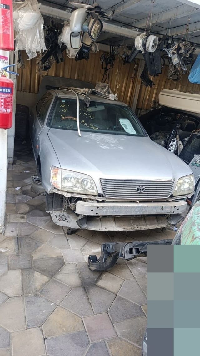 Silver Toyota Celsior for parts with hood, grille and headlights, front bumper removed, Sharjah market