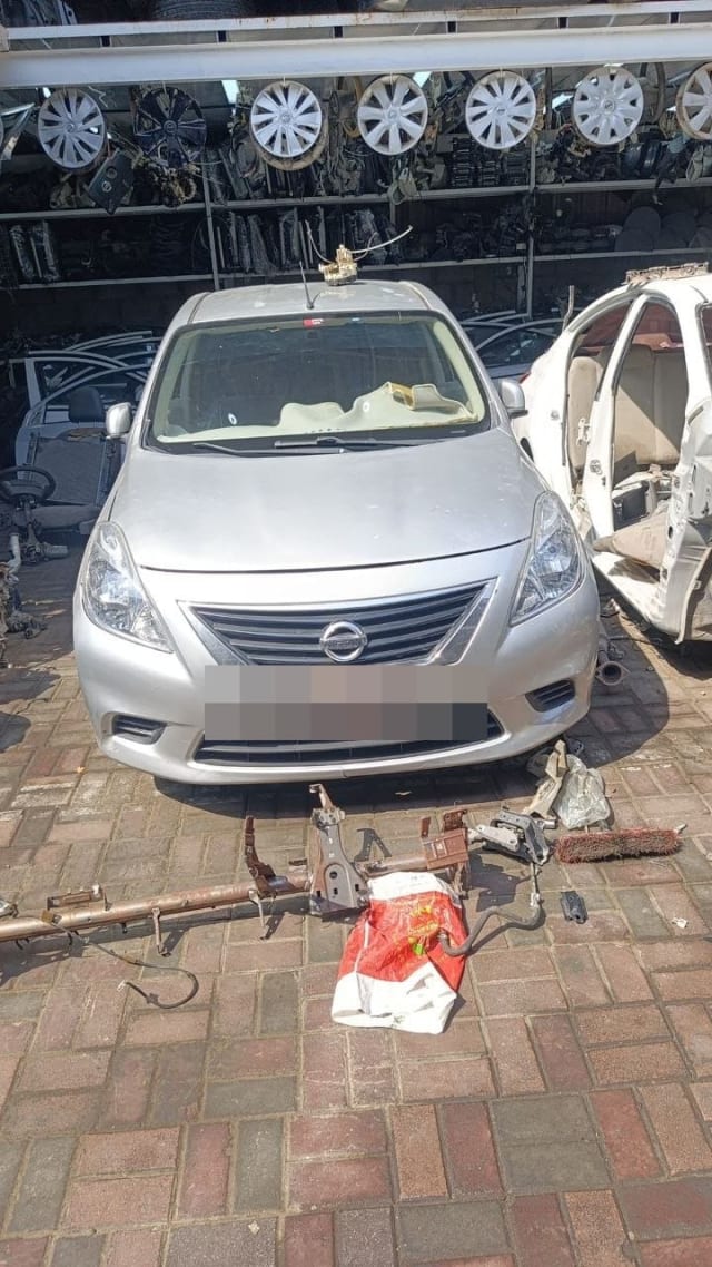 Silver Nissan Sunny sedan halfcut with bumper, grille, headlights and hood, Sharjah market