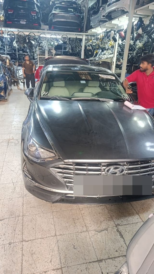 Dark grey Hyundai Sonata sedan for parts — hood, grille, bumper and headlight, Sharjah market
