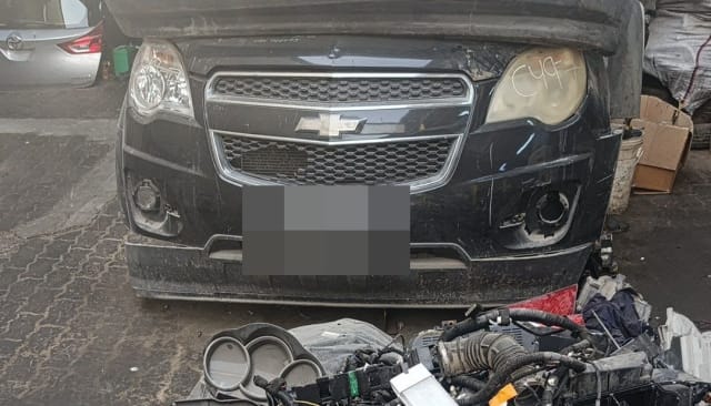 Black Chevrolet Equinox front halfcut with bumper, chrome grille and headlights, Sharjah market