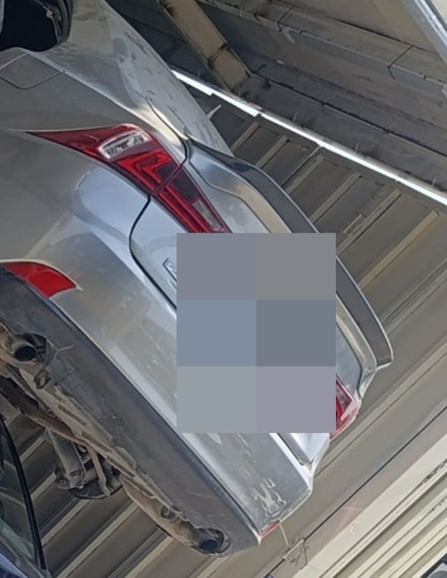 Silver Lexus halfcut rear with LED tail lights, trunk spoiler, rear bumper and dual exhaust, Sharjah market