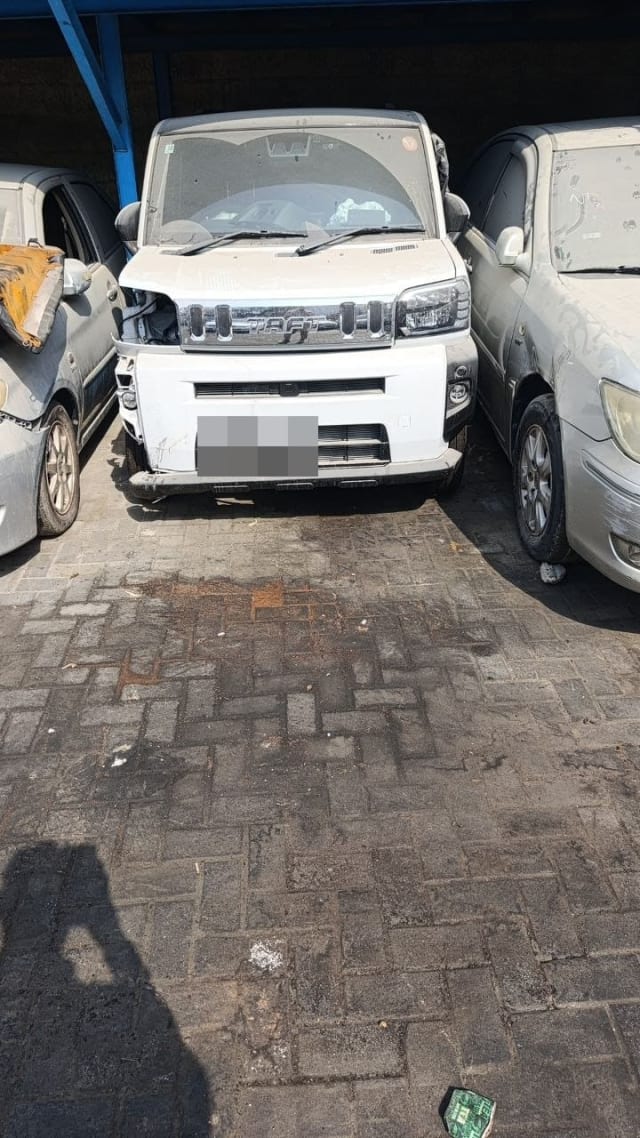 White Daihatsu Taft car for parts, front view: bumper, chrome grille, hood, one headlight, Sharjah market