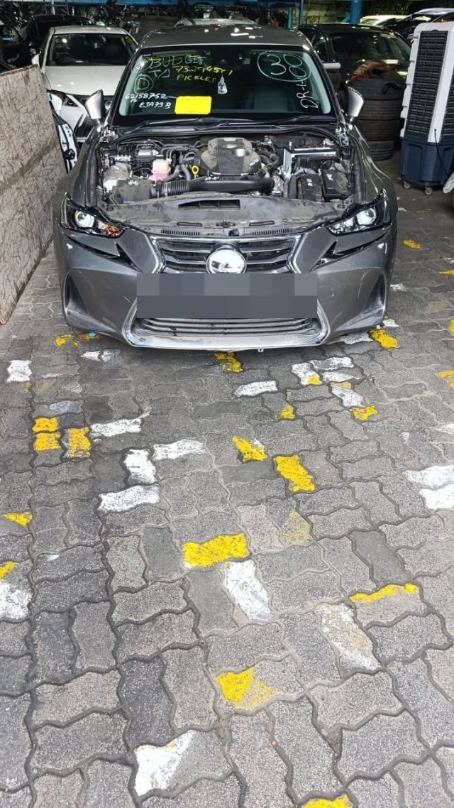 Dark grey Lexus IS sedan halfcut, hood open: engine, bumper, grille, headlights, Sharjah market