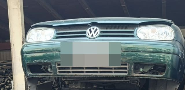 Dark green VW Golf hatchback front halfcut with bumper, grille and headlights, Sharjah market