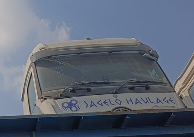 White Mercedes-Benz Actros truck cab halfcut: windshield, wipers, sun visor, grille panel, Sharjah market