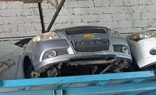 Grey Chevrolet Aveo front halfcut — bumper, grille, headlights and fog lamps, Sharjah market