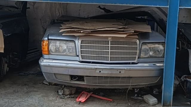 Blue-grey Mercedes-Benz S-Class sedan front — chrome grille, headlights and bumper, Sharjah market