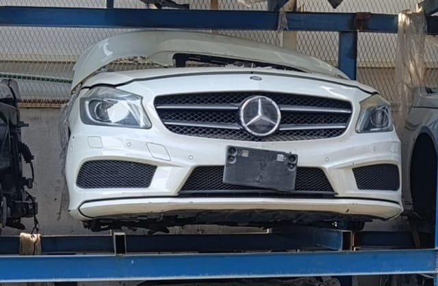 White Mercedes-Benz A-Class front halfcut with bumper, star grille, headlights and hood, Sharjah market