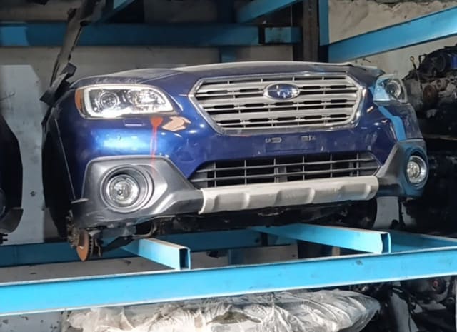 Dark blue Subaru Outback front halfcut — bumper, grille, headlights and fog lights, Sharjah market