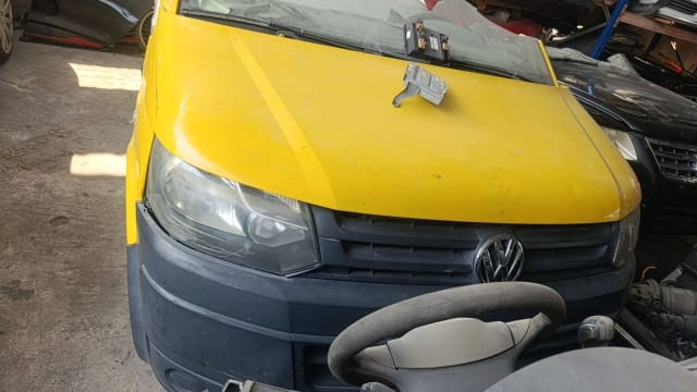 Yellow VW Transporter van halfcut front: hood, grille, headlight and black bumper, Sharjah market