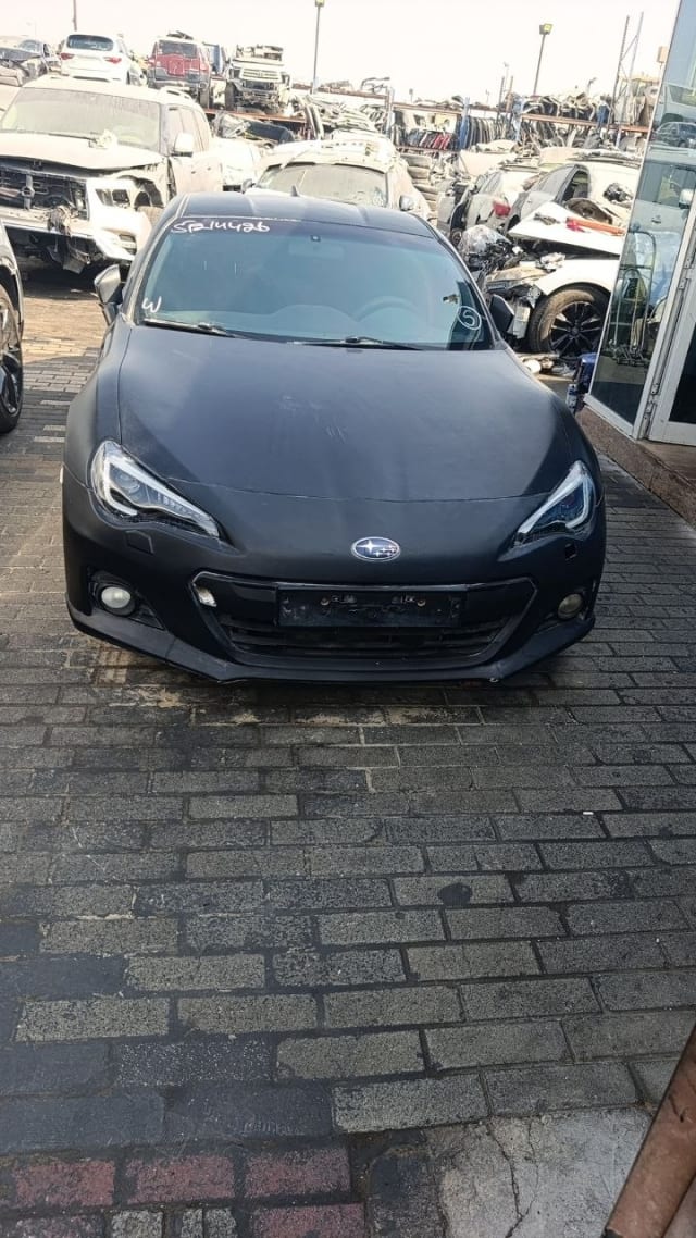 Black Subaru BRZ coupe car for parts, front view — bumper, headlights, hood and grille, Sharjah market