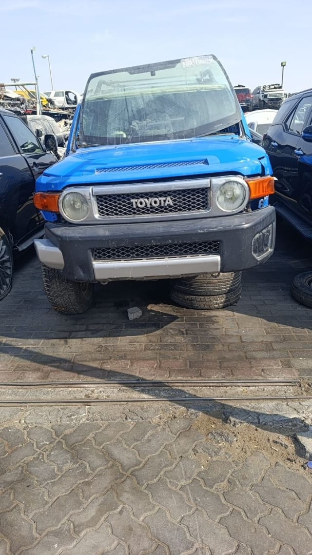 Blue Toyota FJ Cruiser halfcut front — grille, round headlights, hood and bumper, Sharjah market