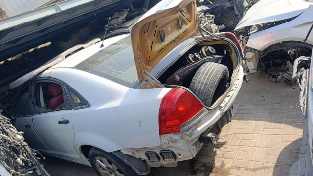 White Chevrolet Caprice for parts — open trunk, taillight, rear doors and wheel, Sharjah market