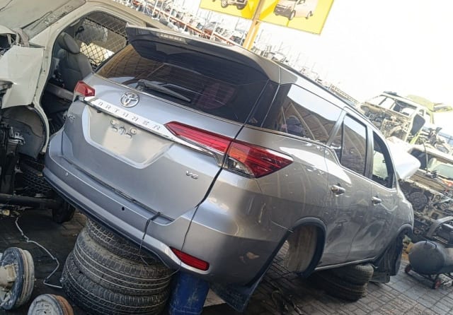 Silver Toyota Fortuner for parts — tailgate, tail lights, rear bumper and doors, Sharjah market