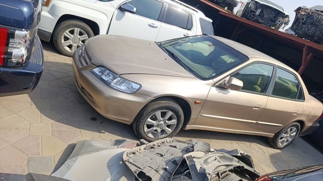 Gold Honda Accord sedan for parts — bumper, headlight, hood, doors and alloy wheels, Sharjah market