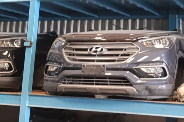 Dark navy Hyundai Santa Fe front halfcut on rack — hood, grille, headlights and bumper, Sharjah market