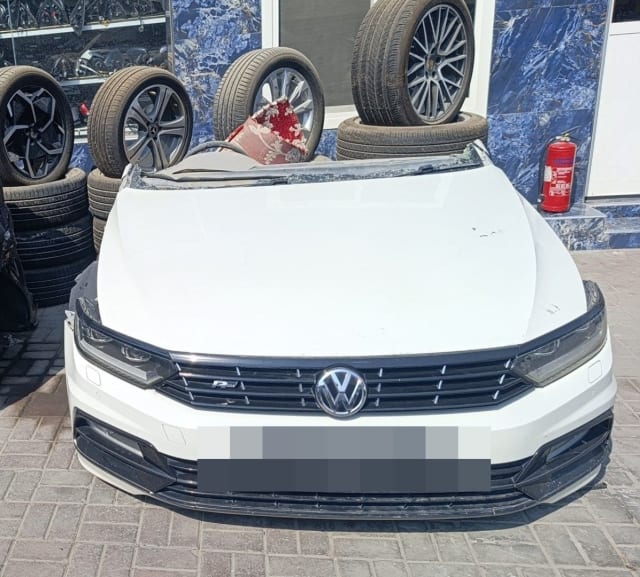 White Volkswagen Passat front halfcut with hood, R-Line grille, headlights and bumper, Sharjah market