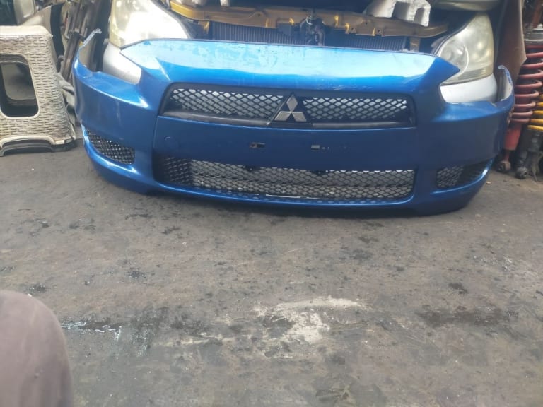 Bumper Mitsubishi Lancer 6400C011XA