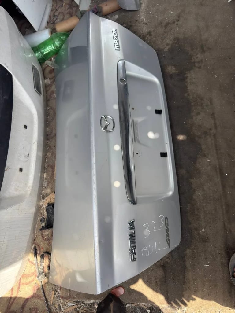 Trunk lid Mazda 323 used in Sharjah — photo 2