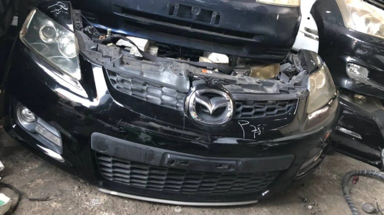 Bumper + Grille + Headlights Mazda CX-7 used in Sharjah — photo 2